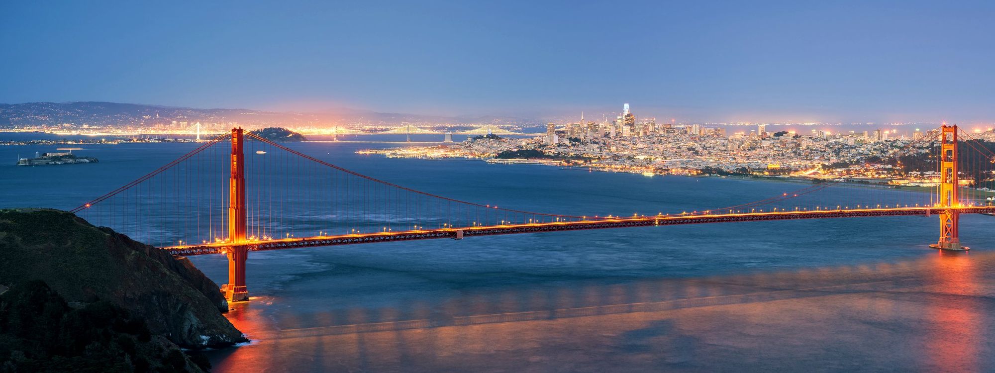 Golden Gate Bridge, Alcatraz and the San Francisco skyline at blue hour from Hawk Hill